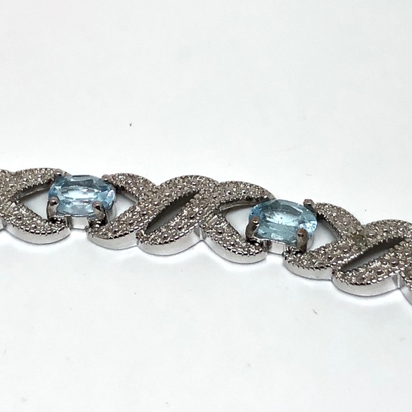 Rhodium Plated Blue Topaz Infinity Bracelet - Picture 4 of 11